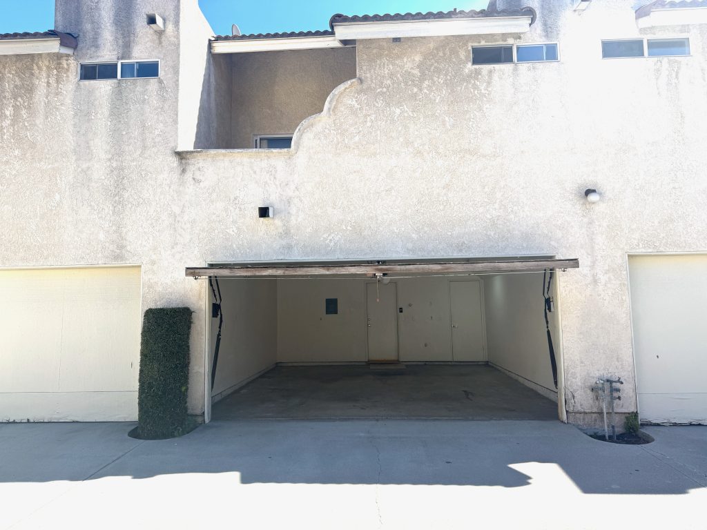 Garage View with Patio Above